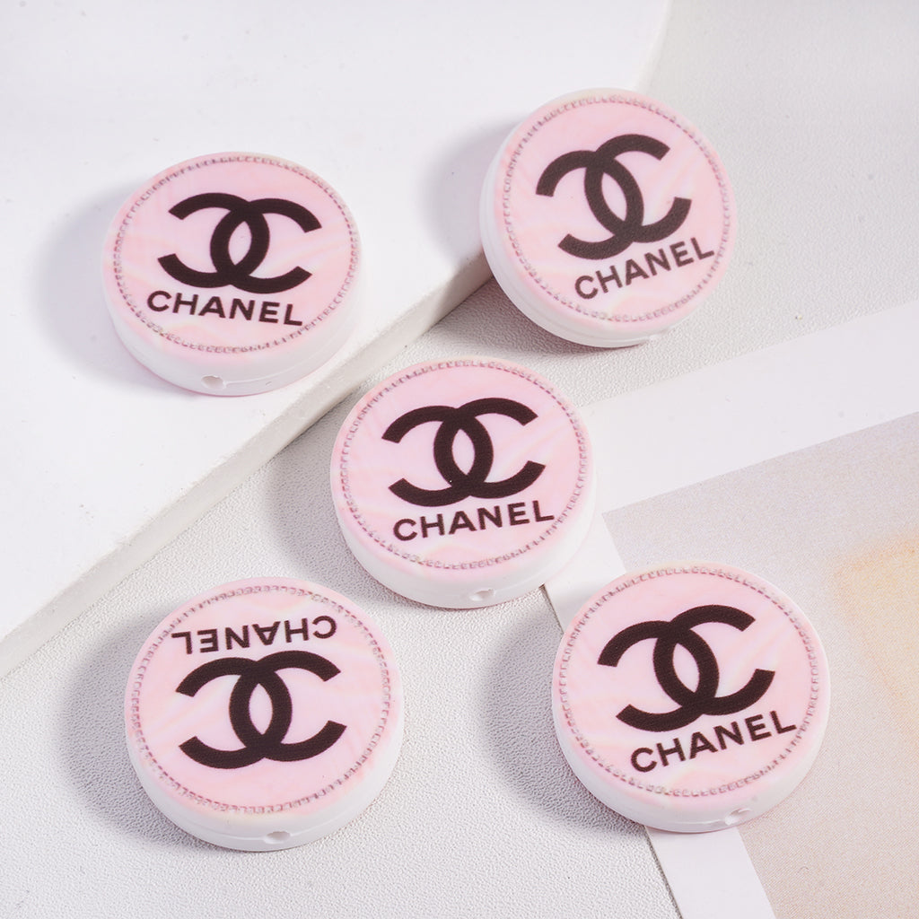 CC Pink Rendering Flat Surface With Black Letter Silicone Focal Beads