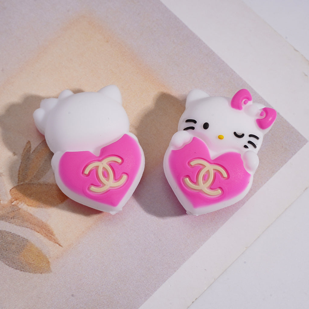A Cute White Cat Holding A CC LV GC Logo Heart Focal Beads.HX