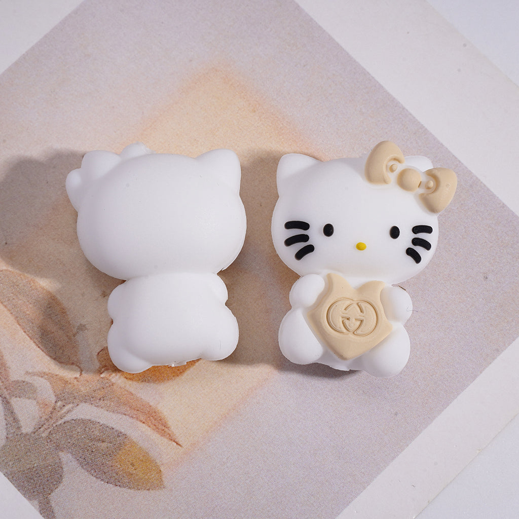A Cute White Cat Holding A CC LV GC Logo Heart Focal Beads.HX
