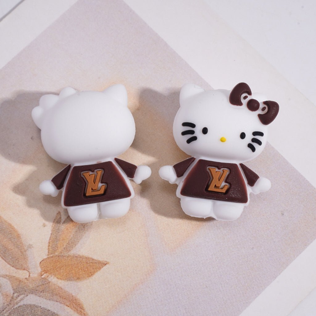 A Cute White Cat Holding A CC LV GC Logo Heart Focal Beads.HX