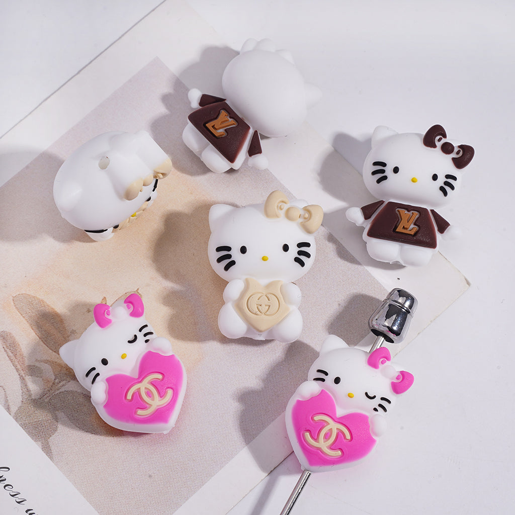 A Cute White Cat Holding A CC LV GC Logo Heart Focal Beads.HX